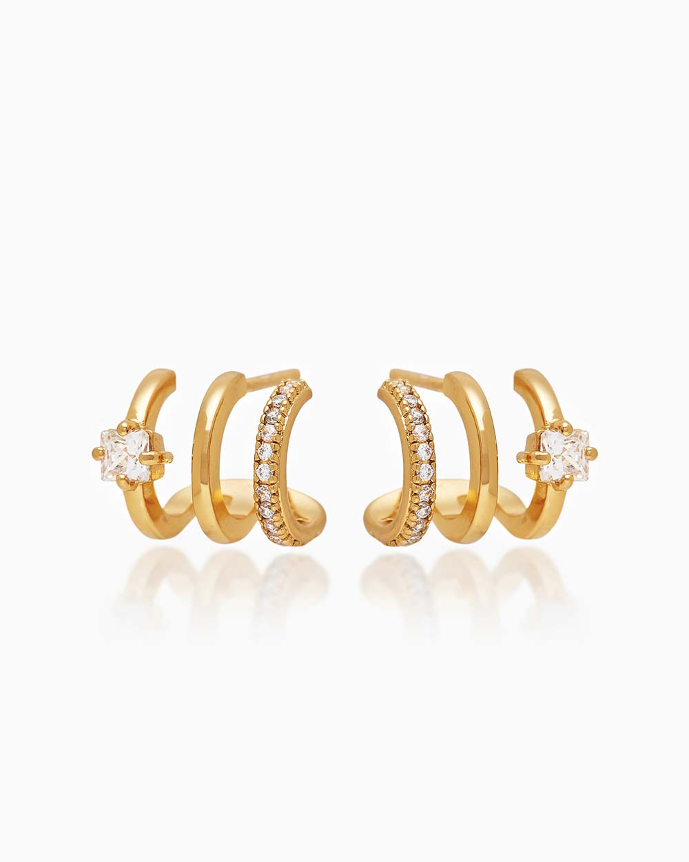 The Anya Huggies, gold illusion earrings that give you three petite hoops and styles in one
