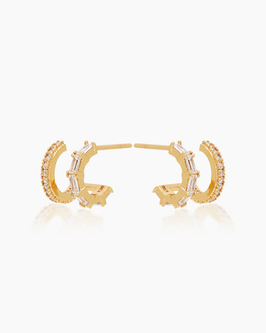 The Brooke Huggies, double stacked gold illusion earrings featuring both round cut and baguette cut cubic zirconia