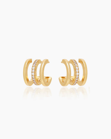 The Chesca Huggies, gold illusion earrings that give off the look of a three-piece stack