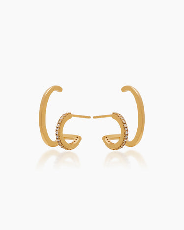 Gold illusion earrings that make it look like you're wearing two gold earrings: a suspender and a huggie