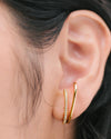 The Vanessa Huggies worn on a person's left ear