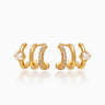 The Anya Huggies, gold illusion earrings that give you three petite hoops and styles in one