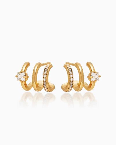 The Anya Huggies, gold illusion earrings that give you three petite hoops and styles in one