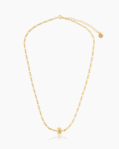 A full-length shot of the Erica, a minimalist and ultra-stackable gold necklace with a unique link chain and bead pendant