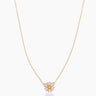 The Flora, a gold pendant necklace featuring a daisy-like flower crafted with cubic zirconia