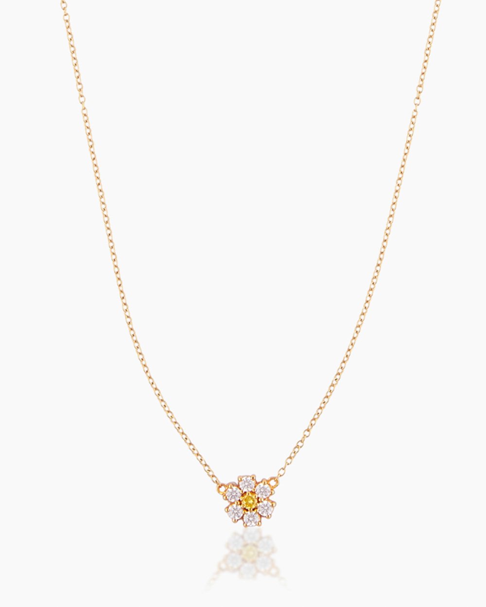 The Flora, a gold pendant necklace featuring a daisy-like flower crafted with cubic zirconia