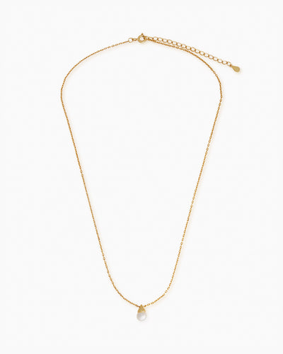 A full-length shot of the Alicia, a classic pearl pendant necklace with a freshwater pearl and a delicate golden chain