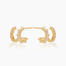 The Brooke Huggies, double stacked gold illusion earrings featuring both round cut and baguette cut cubic zirconia