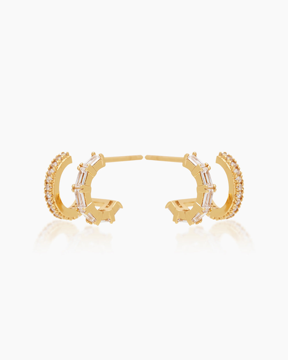 The Brooke Huggies, double stacked gold illusion earrings featuring both round cut and baguette cut cubic zirconia