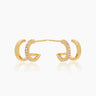 The Emilia Huggies, gold double-stacked illusion earrings featuring one hoop paved with cubic zirconia