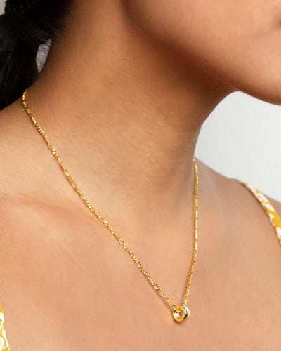 The Erica Necklace worn around a woman's neck