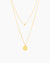 The Sofia, a gold two-layer illusion necklace with a dainty golden ball and a classic round pendant