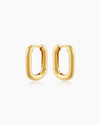 The Venus Huggies, oval-shaped gold earrings that exude elegant simplicity