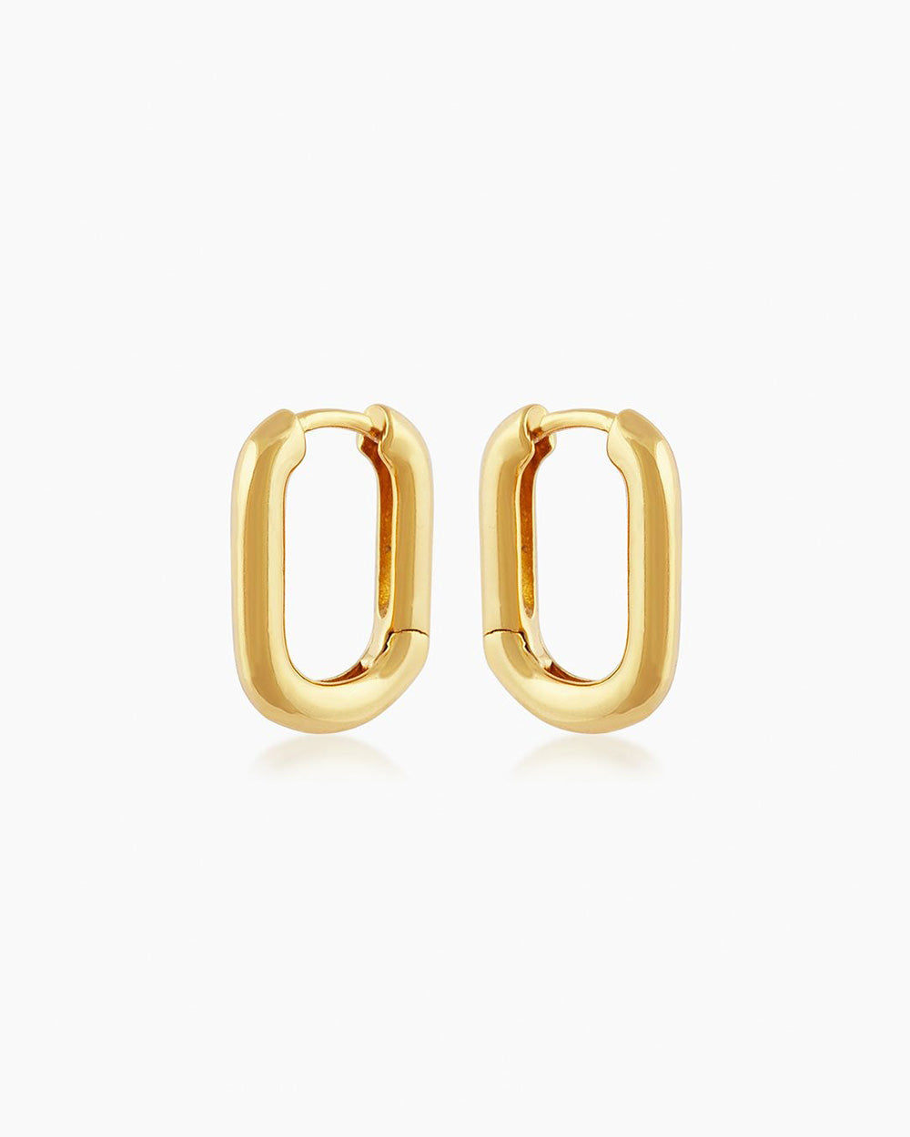 The Venus Huggies, oval-shaped gold earrings that exude elegant simplicity